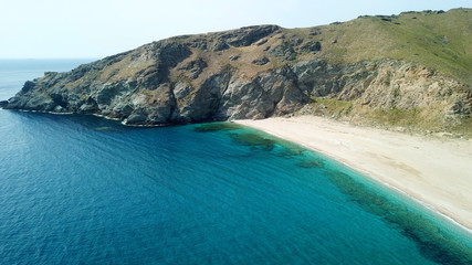 Aerial drone bird's eye view photo of iconic beach with turquoise clear waters located in Greek island © aerial-drone