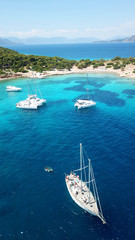 Aerial drone bird's eye photo of tropical paradise island beach with emerald crystal clear waters