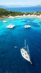 Aerial drone bird's eye photo of tropical paradise island beach with emerald crystal clear waters