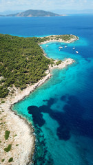 Aerial drone bird's eye photo of tropical paradise island beach with emerald crystal clear waters