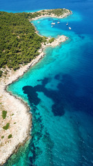 Aerial drone bird's eye photo of tropical paradise island beach with emerald crystal clear waters