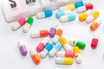 colorful pill in the box on white background