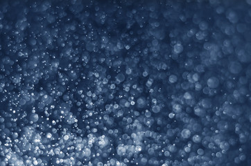 abstract blue bokeh glitter sparkle background.