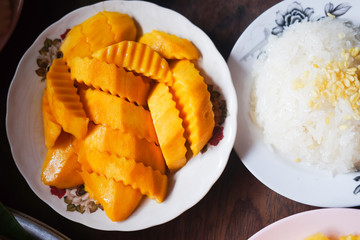 Mango sticky rice in white dish