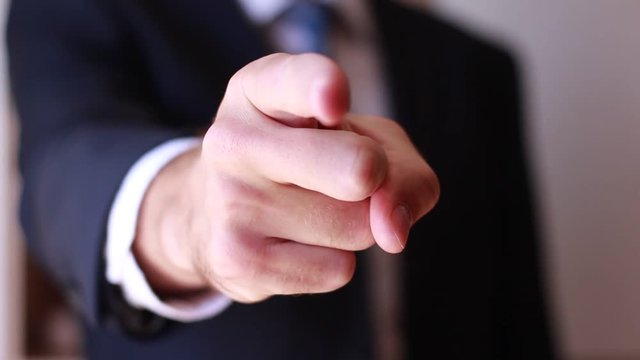 Male forefinger pointing close up