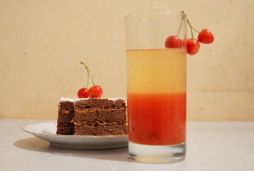 fruit juice, cake and cherries

