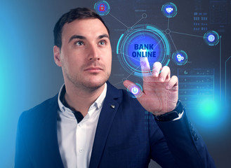 Business, Technology, Internet and network concept. Young businessman working on a virtual screen of the future and sees the inscription: Bank online