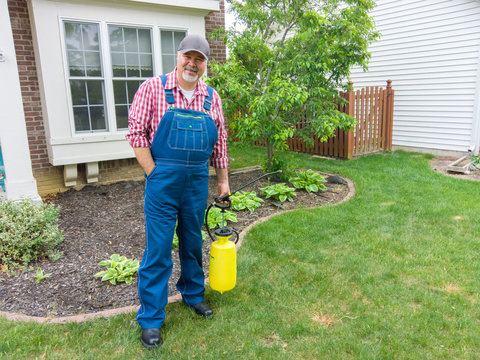 Property owner or gardener with a portable sprayer