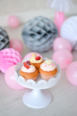 One year birthday Cake. Cake for holiday party. a lot of balloons pink and grey colors. 