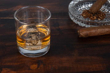 whisky on the rock on wood and wood background