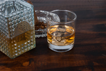 whisky on the rock on wood and wood background
