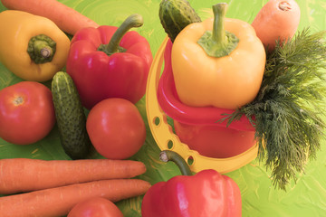 Set of various colorful fresh raw vegetables on a colored background