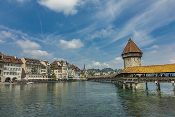 Fototapeta na wymiar Chapel bridge and Water tower on Reuss river in Lucerne
