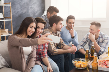 Young people in casual clothes are resting at home