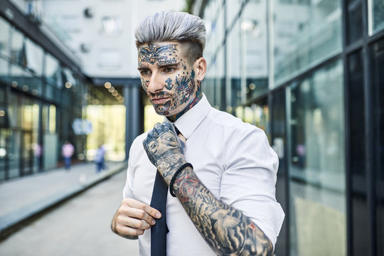 Young Businessman With Tattooed Face