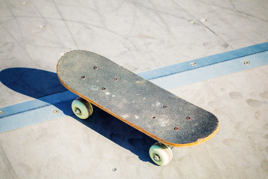 Old skateboard on ramp