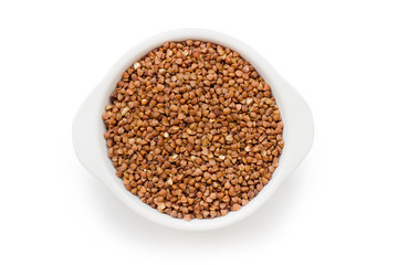 buckwheat groats in a white bowl on a white background