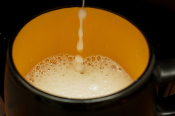 preparation of coffee with milk in the coffee machine