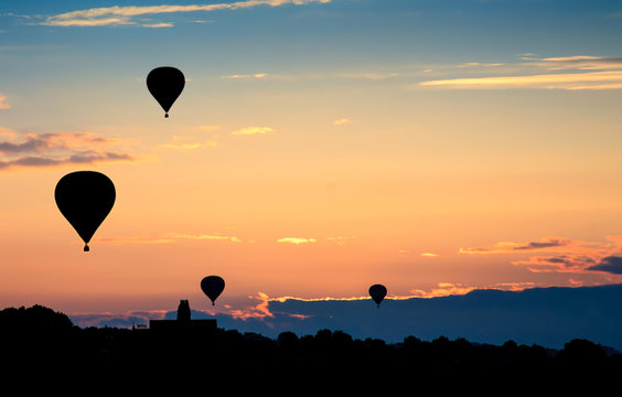 Hot air balloons on sunset. Beautiful nature background.