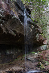 Waterfall cascading over rock ledge at Cumberland Falls State Park