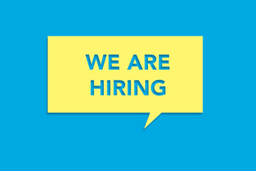 We are hiring message on a yellow sticky note on a blue background