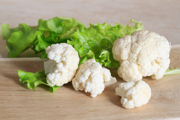 Cauliflower on a wooden background. Close-up. Copy space.