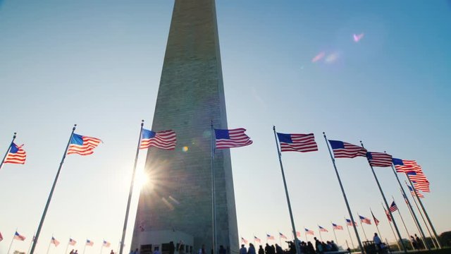 Sunlight shines because of the Washington Monument, DC. Tilt shot