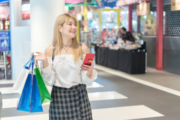 Beautiful asian woman shopping  with shopping bags at department store,Thailand people shop at mall,Lifestyle of modern girl,Happy woman concept