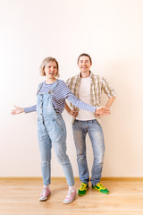 Image of man and woman in new empty apartment