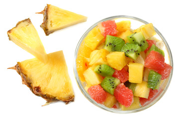 Bowl of healthy citrus fruit salad isolated on white background. Top view.