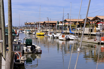 Ostreicole harbor of Andernos-les-bains, commune is a located on the northeast shore of Arcachon Bay, in the Gironde department in southwestern France. - obrazy, fototapety, plakaty