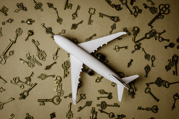 Model airplane and pile of key - for success and business background