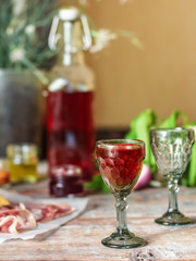 liqueur in a glass on a wooden table (wine) - (celebration) - drink cuisine.  Food background