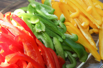 a colorful dish of red and yellow green pepper