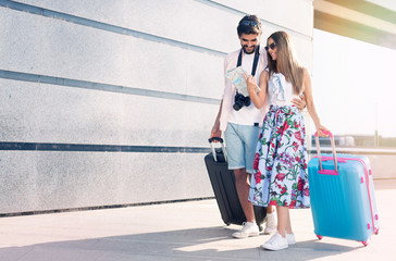 Young couple travelers with luggage