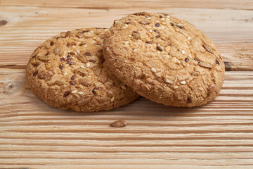 Fresh baked homemade crispy oatmeal cookies on wooden background, concept of delicious healthy dessert. space for text under cookies, copy space