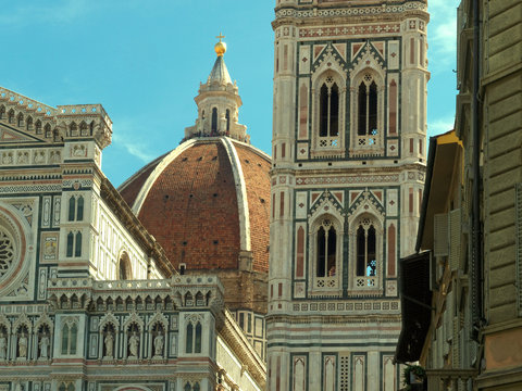 Closeup of the iconic ornate marble facades ot the Cathedral of Florence and Bell Tower in Florance, Tuscany, Italy