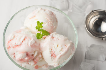 Ice cream with jam and mint, close-up