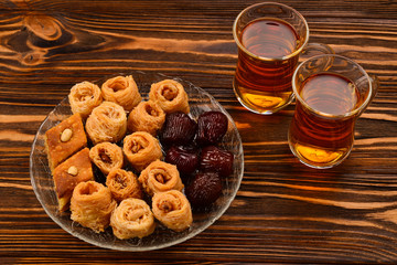 Turkish sweet baklava on plate with Turkish tea. 
