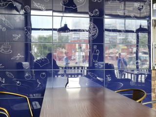 table and blue wall in a cafe