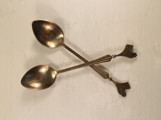 two metal teaspoons