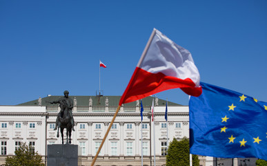 Flag of Poland and the European Union flag against the background of the Presidential Palace in...