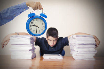hand with watch and child studying at the desk or school