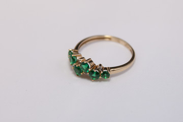 gold ring with emeralds