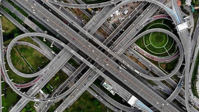Bangkok Expressway top view, Top view over the highway,expressway and motorway. Aerial view interchange of a Thailand Bangkok city, Shot from 4K HD drone.