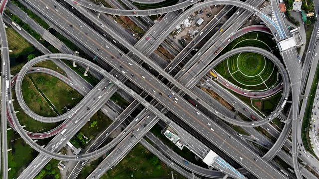 Bangkok Expressway ,Top view over the highway,expressway and motorway. Aerial view interchange of a Thailand Bangkok city, Shot from 4K UHD drone.