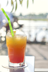 FRESH FRUITY ALCOHOLIC DRINK, LIQUEUR WITH STRAW, STRAWBERRY, CHERRY AND MINT. copy space