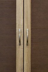 front doors of a wooden cabinet