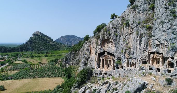 Aerial. Ancient Lycian six rock-cut tombs, Dalyan, Turkey. 4K.