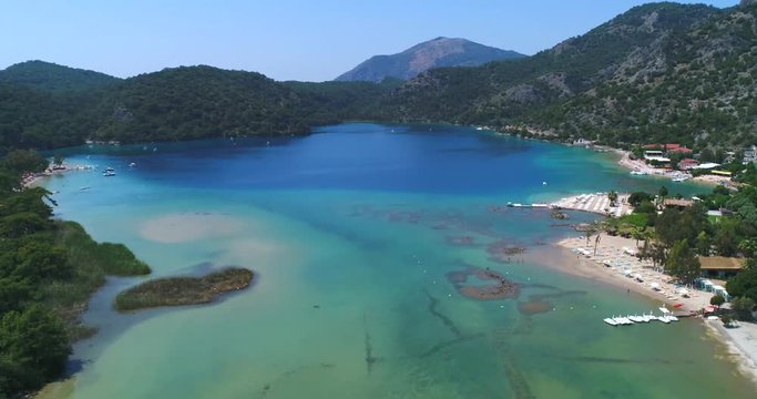 Aerial. Flying above Oludeniz beach. Beautiful Bay with crystal water. Turkey. 4K.